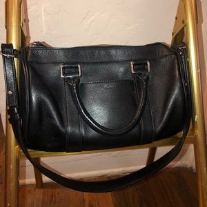 Shinola black purse, concave shaped